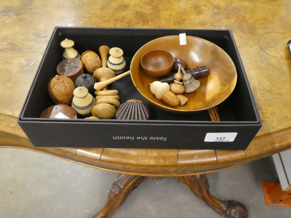 A small quantity of wood turned items to include an acorn, egg, spinning tops, thimble and several