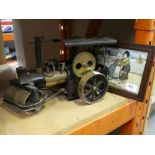 A model steam roller with moving parts and a lithograph of a Dutch scene by Ethel Parkinson - 1868 -
