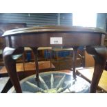 Oak rectangular coffee table and a mahogany circular example on cabriole supports