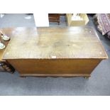 A Victorian combed grain blanket chest with fitted interior on a shaped bracket plinth