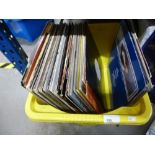 A box of 12" vinyl singles to include EMF, The Real Thing, The Prodigy, also some LPs