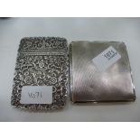 A white metal, possibly Continental, ornate card case with hinged lid approx 3.65 oz, and a silver