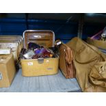 A shelf of mixed sundry items to include a Liling tea service, vintage ice skates, leather belts,