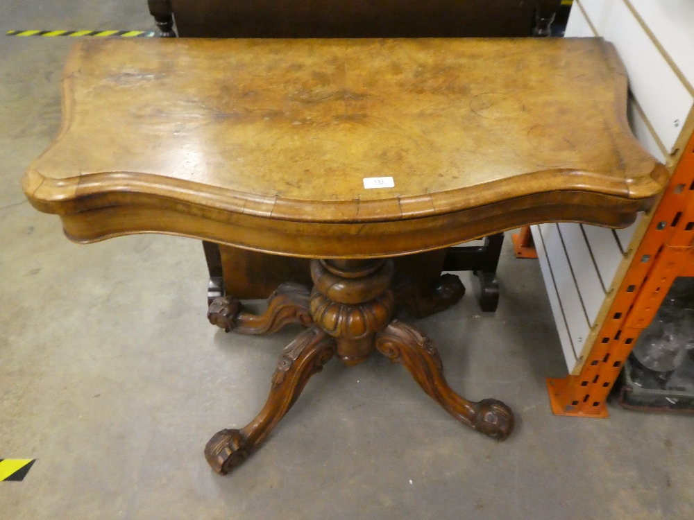 A Victorian burr walnut foldover card table with carved quadropod base, 96 cms
