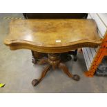 A Victorian burr walnut foldover card table with carved quadropod base, 96 cms