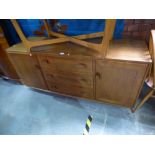 Ercol light elm sideboard with three central drawers flanked by cupboards