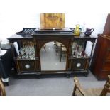 A 19th Century ebonised ormolu mounted credenza with Wedgwood plaques to the outer doors and a