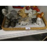A small tray of animal figures to include a Beswick cat, Sylvac Rabbit and dog, Lladro cat, Tang