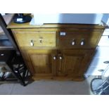 Waxed pine hall cabinet with 2 drawers above cupboards