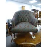 A button back library chair of large proportions on turned legs, possible early 20th century