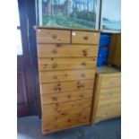 Tall waxed pine chest of 2 short over 8 long drawers