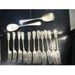 A pair of hallmarked spoons marked London 1930, 5.75 oz and a set of 11 plated forks - marks