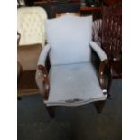 A Reproduction mahogany Gainsborough armchair on square moulded legs