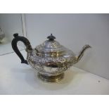 A William IV silver tea pot with ornate design hallmarked London 1831, retailed by Makepiece