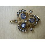 Victorian style 9ct yellow gold pendant/brooch of clover design set with seed pearls, pale sapphire