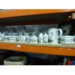 A shelf of Portmeirion tableware to include placemats, tablecloths, cups, cruets, butter dish, etc