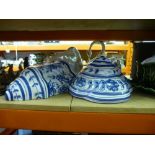 A large soup tureen in the form of a cauliflower along with two black and white wall mounted