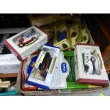 A quantity of boxed diecast cars with two wooden display racks