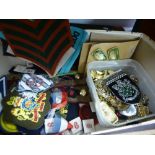 A box of military items to include cap badges, cap, belts, etc