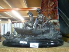 A bronze sculpture of a boy and girl in a fishing boat, of recent manufacture