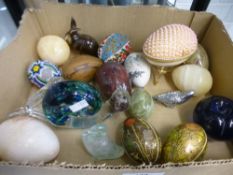 A quantity of egg ornaments, some being onyx alongside some glass ornaments