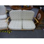 An Ercol stickback two seat settee, with open armchair and stool