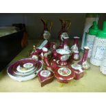 A quantity of red and gold Limoges porcelain