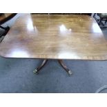 An antique mahogany tilt top breakfast table on quadrepod supports, 132 cms