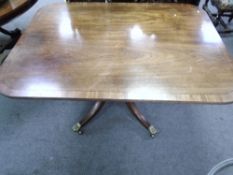 An antique mahogany tilt top breakfast table on quadrepod supports, 132 cms