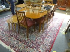 Mid Century teak extending table and set 6 teak barback dining chairs upholstered in pink fabric