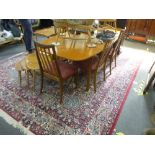 Mid Century teak extending table and set 6 teak barback dining chairs upholstered in pink fabric