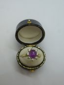 18ct yellow gold cluster ring with central cabouchon amethyst, surrounded by 8 diamonds, size U,