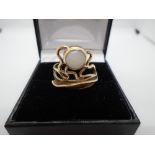 9 carat gold ladies ornate ring containing a single Opal - gross weight approx 3.7g