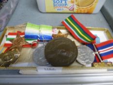 A small quantity of WWII medals and a medallion