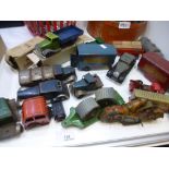 A quantity of vintage tin toy vehicles