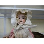A German bisque head doll numbered 390