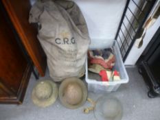 Various old helmets - some military - a GB flag, a canvas kit bag and sundry
