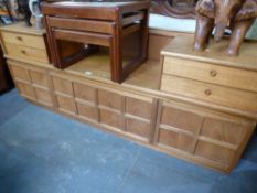 A large Nathan teak sideboard, a nest of coffee tables having tiled tops and sundry