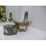 A silver lot comprising of a large sugar shaker, worn, a music box marked London and a dish marked