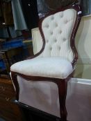 A reproduction button back nursing chair