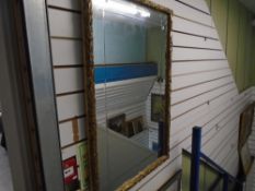 A gilt oblong wall mirror, 65 x 95 cms