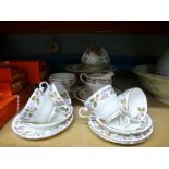 An Aynsley April Rose design tea set comprising six tea cups and saucers, cake plates, sugar bowl,