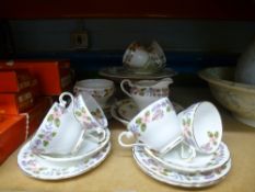 An Aynsley April Rose design tea set comprising six tea cups and saucers, cake plates, sugar bowl,