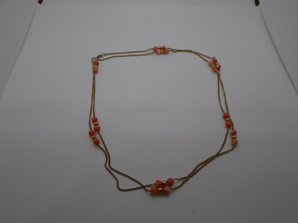 9 carat gold necklace stamped 375, with what appear to be coral beads, gross weight approx 5.6g