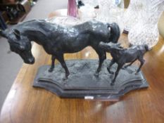 A modern French bronzed sculpture of mare and foal on shaped base, 55cms