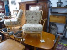 Two Ercol open armchairs having matching upholstery