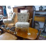 Two Ercol open armchairs having matching upholstery