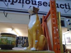 A large ceramic figure of a boxer dog