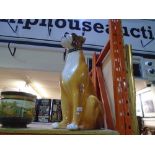 A large ceramic figure of a boxer dog