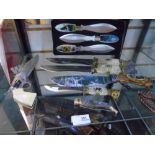 A selection of decorated knives to include boxed set of 3 throwing knives